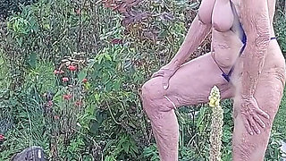 Watch 77 Years Old Martina Alsmost Naked in Her Garden