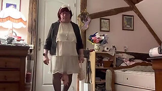 Dressed in a little cream-colored ruffled dress for an evening