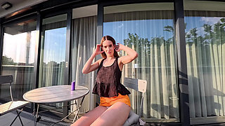 Hot Long Legs Sexy Beauty on the Balcony Flashes Her Panties Under Her Skirt Then Takes Underwear off to Show Tight Pussy