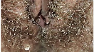 Best close-up of peeing on a thick, hairy pussy