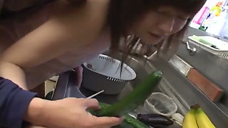 Insatiable Young Wife Drenches Cucumber Deep in Kitchen Sink