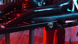 Heavy rubber masked latexgirl stretched and tickled