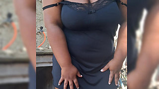 Hot neighbor prepares lunch in the backyard, and shows her pussy outdoors
