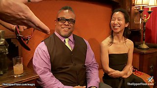Slaves entertain guests at bdsm party