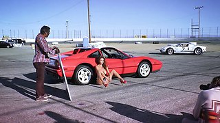 Big tits MILF posing behind the scenes