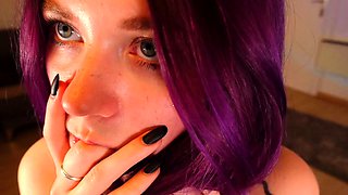 Redheaded pierced teen close up toy show