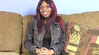 Black Chick with Nipple Rings on Her Big Tits Spreads Her Legs on the Couch