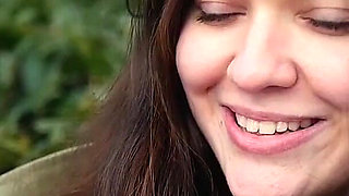 Young Brunette Is Taking an Unhurried Stroll with Allwhite 120mm Cigarette