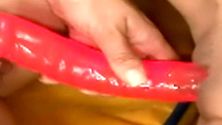 Blue and Pink Toys on the Yellow Couch - Slim Brunettes Kiss While They Fill Each Other