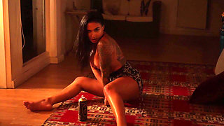 Sensual Latina Doing a Striptease in Low Light