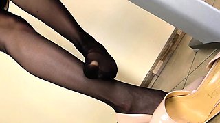 Lady Scarlet licks her feet in office
