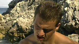 Two Hung Muscle Studs Pound a Young Jock Anal on the Sand in