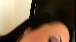 Slender brunette with a pierced tongue sucks the cameraman's cock
