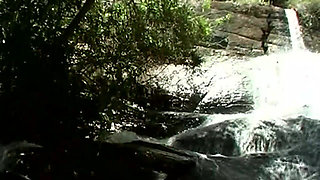 Mature Brunette MILF Pleasures Cock by Waterfall with Facial