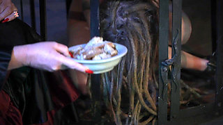 The Wild Maid Fina Is Kept in a Cage and Slimes Out of Her Mouth as She Greedily Eats Food From the Countess's Hand
