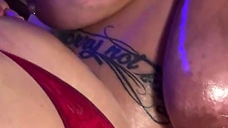 Fat, Tattooed Women Playing with Oil on Their Enormous Bodies.