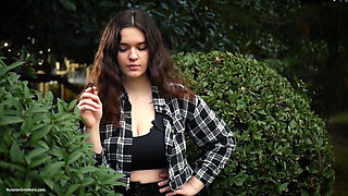 Sweet and Busty Russian Babe Smoking Cigarette in Nature