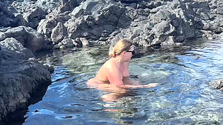 Nudist Girl Swimming Naked in the Natural Pool Outdoor