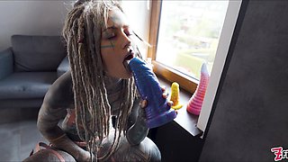 Gorgeous tattooed girl fucks her ass