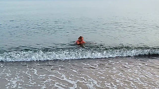 POV. You Watch as a Busty Model, of Your Presence, Strips Naked on the Beach, Bathes, and Plays in the Sand.