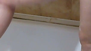A Neighbor with Big Tits and a Big Ass Takes a Bath and Shaves Her Pussy