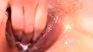 Thai amateur Kanya rubs her soaking cunt
