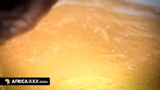 Ebony babe plays with her small tits and dildo in a relaxing bath