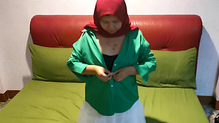 Hijab girl plucks under a white skirt