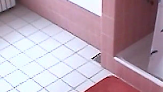 Amateur blonde masturbates on toilet