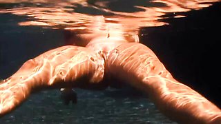 An awesome BBW babe Cherry Brady swims in the pool with boobs naked