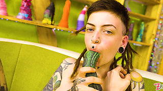 Skinny Inked Girl with Dreadlocks vs. The Toy Wall She's Covered, Everywhere