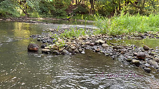 Cute Teen in Costume Playing in the River Like in a Swimming Pool