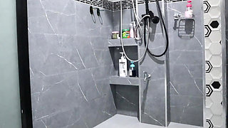 A Thai Woman Is Taking a Shower, Revealing Her Pink Nipples and Smooth, Soft Vagina While Applying Body Lotion