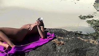 Naked on the beach