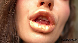 Extremely Shiny Metallic Golden Kiss Close up