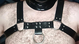 A man masturbates while wearing two latex masks.