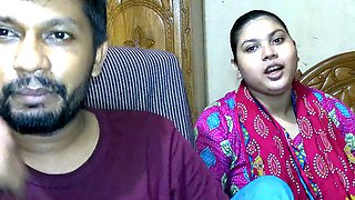 Newlywed couple and their friend getting cozy in an Indian village