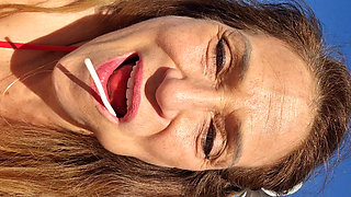 Melissa Johnson Sucks and Licks a Cherry Lollipop on the.beach