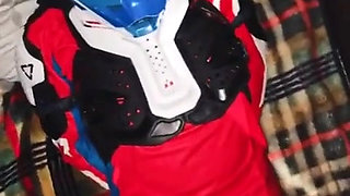 A Guy in a Motocross Gear Gets a Portion on His Mxhelmet