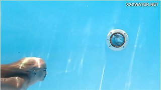 Petite blonde and charming model swim together