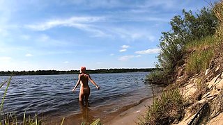 Blonde Solo Girl Cooks Naked by the Campfire