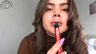 Smoking and Vaping with Gold Shiny Lipstick Close-up