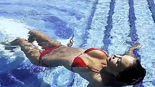Monika Fox Swims In The Pool In A Red Bikini