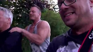 Pretty stranger takes on two guys outdoors